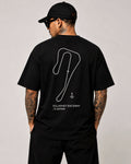 Circuit 001 Track Only tee in black, worn from the back: the Killarney Raceway circuit as one clean line, printed in white