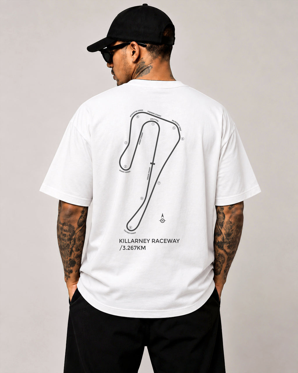 Circuit 001 Detailed tee in white, worn from the back: the Killarney Raceway map with every corner numbered and named, printed in black