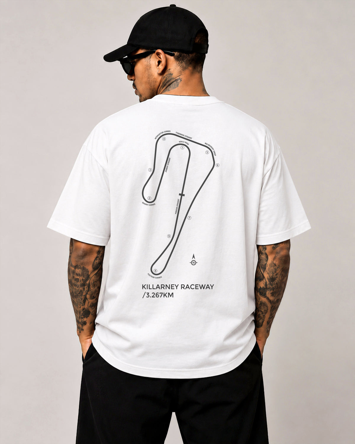 Circuit 001 Detailed tee in white, worn from the back: the Killarney Raceway map with every corner numbered and named, printed in black