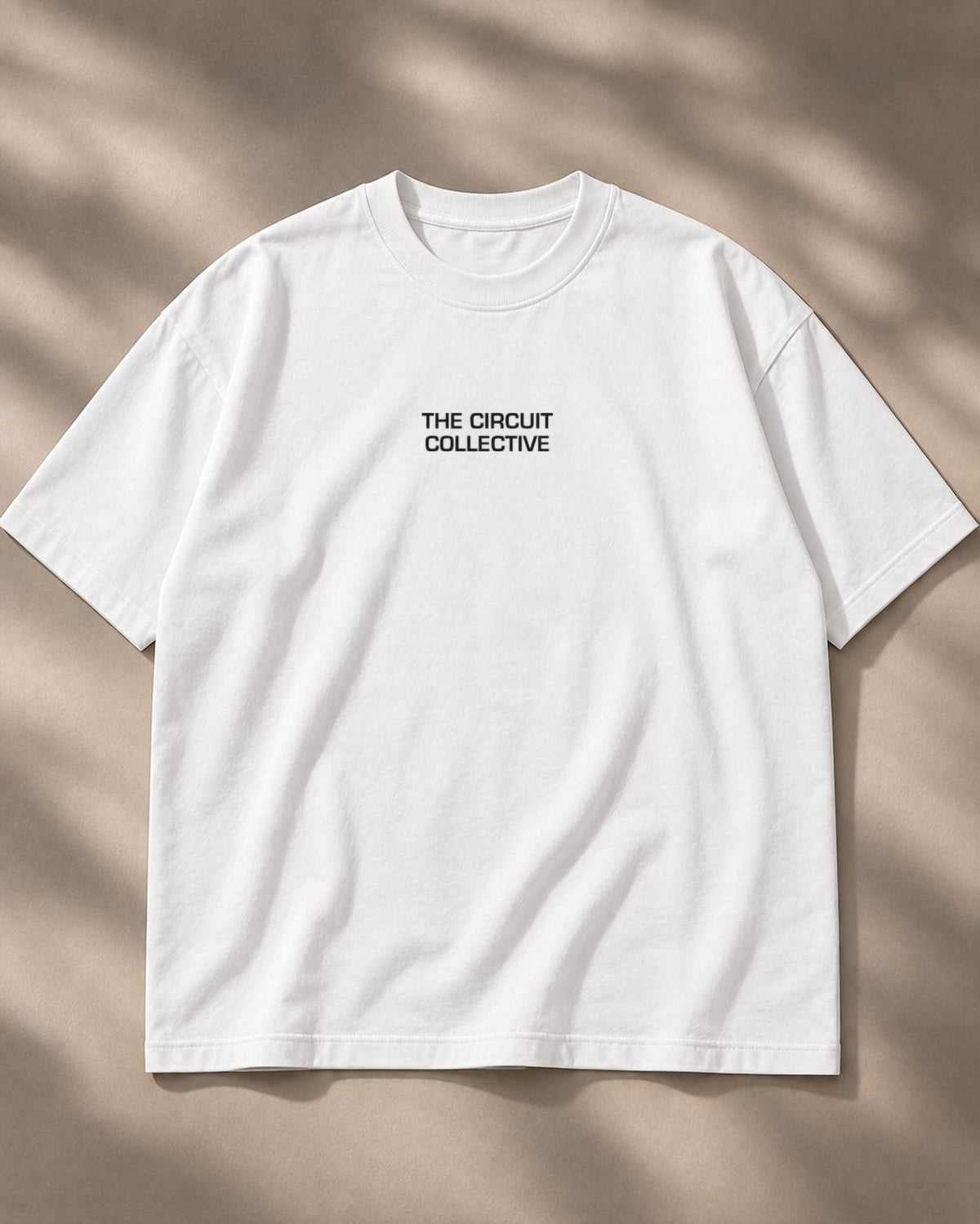 Circuit 001 Track Only tee in white, laid flat from the front: The Circuit Collective wordmark on the chest