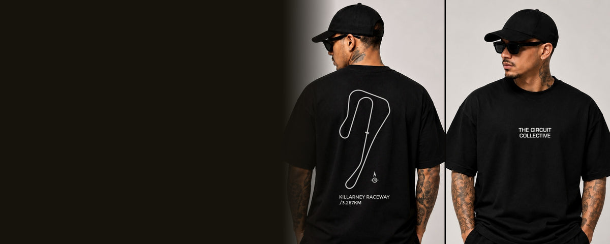 Circuit 001 on a model: the Killarney Raceway circuit printed in white on the back of a black tee, and The Circuit Collective wordmark on the front